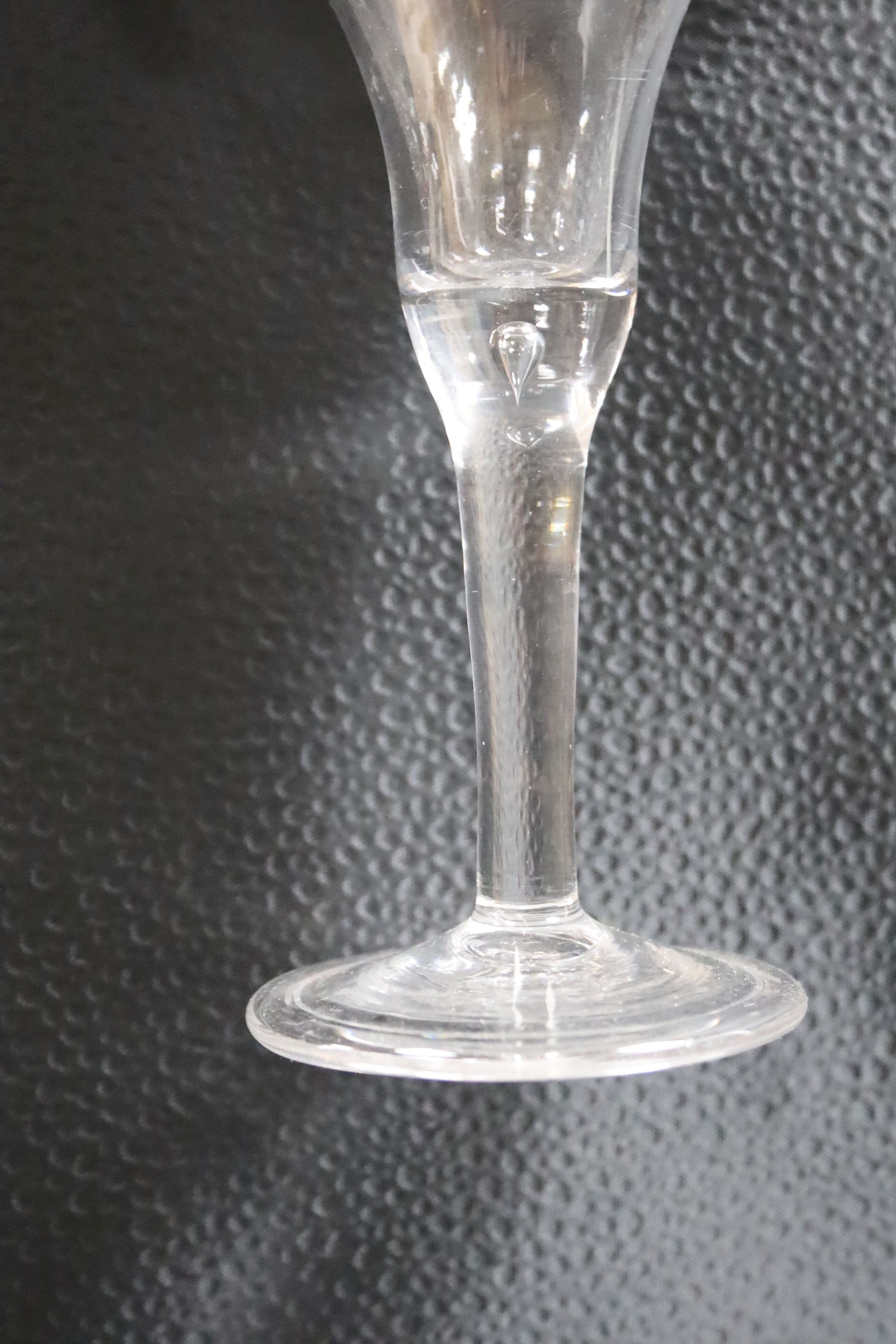 Three 18th century plain stem ale glasses, tallest 16.5cm